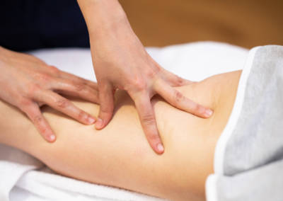 Medical massage at the leg in a physiotherapy center.